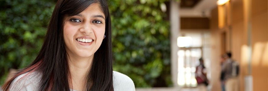 A female student smiling for the camera